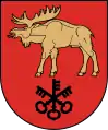 A coat of arms depicting a golden moose with large antlers and a protruding red tongue hovering over three black keys