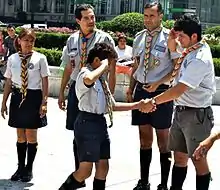 Mexican scouts using the handshake to welcome new members