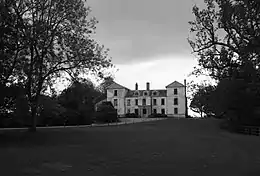 Exterior of quite large country house in extensive gardens