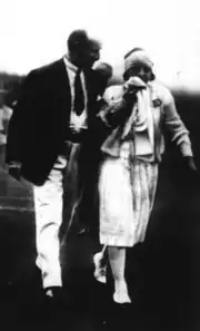 Lenglen walking off the court after retiring against Mallory alongside FFLT vice president Albert de Joannis