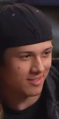 Headshot of Leo Howard wearing a baseball cap and looking off to the right.