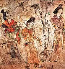 Women (middle and right) wearing yuanlingpao with tight and narrow long sleeves, Tang dynasty tomb, 706 AD