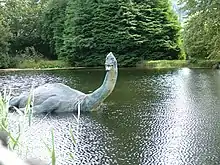 Model of a dinosaur in water