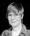 Lois McMaster Bujold with pixie cut and denim western shirt, 1996.