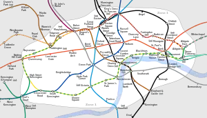 Diagram containing several differently-coloured lines connecting nodes that are small hollow black circles. The lines and stations are at geographically accurate positions, with the curved lines drawn more flexibly than on the traditional Tube map. The river is also included, represented as a geographically accurate light blue strip. This map is arguably harder to read.