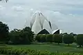 The Lotus Temple with trees in front