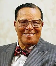 Louis Farrakhan smiling while facing the camera.