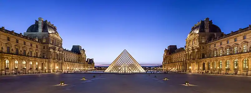 The Napoleon Courtyard and I. M. Pei's pyramid in its center, at dusk.