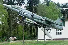 F-104 mounted on zero-length launch platform with rocket booster attached