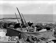 A half-track shooting at several aircraft after Normandy.