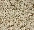 A 24.66 inches (626 mm)-wide fabric swatch of MARPAT desert pattern