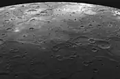 Lava-flooded craters and large expanses of smooth volcanic plains on Mercury.