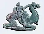 Nomadic figure, typically with a long nose, on a Bactrian camel. Southern Ningxia, 4th century BC.