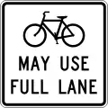 R4-11Cyclists may use full lane