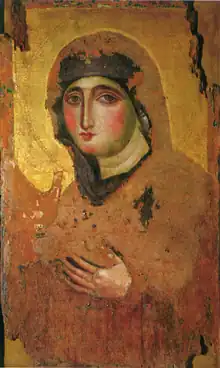 Slightly faded painting of a woman wearing a black veil, staring out of the portrait. Her hands are raised. The image is on a gold background.