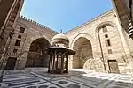 Example of the cruciform four-iwan layout in the Madrasa-Mosque of Sultan Barquq (1386)