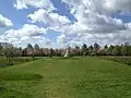 Main Stupa and trees in bloom at Amaravati Monastery UK