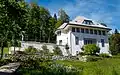 Maison Blanche in La Chaux-de-Fonds. Note the mixed coniferous-deciduous forest in background.