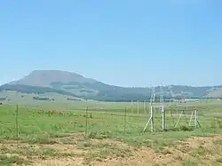 Majuba Hill seen from Laing's Nek; buildings on the right include the museum.