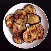 Eggplant slices are pan-fried.