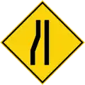 Road narrows on the left