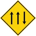 Three-lane carriageway ahead, with one lane in the opposing direction