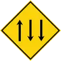 Three-lane carriageway ahead, with two lanes in the opposing direction.