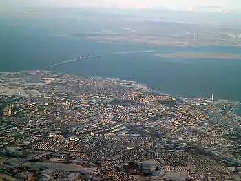 The Øresund strait between Malmö and Copenhagen with Malmö in the foreground and the island of Amager and part of southern Copenhagen in the background