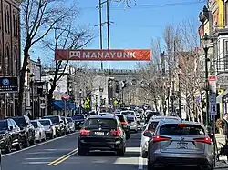 Manayunk Main Street with the Manayunk Bridge in the background