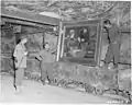 The painting was brought along with other pictures from the German National Gallery to a mine to protect it from the bomb war in World War II. This 1945 photograph shows US soldiers with the painting in the Merkers salt mine.