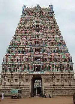 A pyramidal temple tower with sky in the background