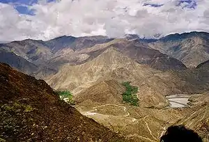 A river flowing through a mountainous landscape.