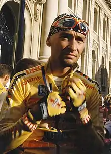 Portrait of Marco Pantani wearing a bandana and glasses on his head