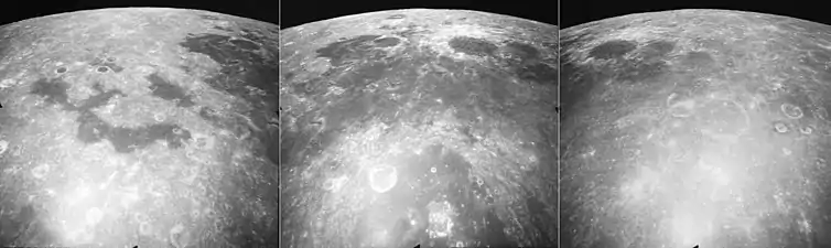 These are three views of Mare Marginis, taken by the mapping camera of the Apollo 17 mission in 1972, facing north-northeast from an average altitude of 124 km.  At the right is the east side of Mare Marginis, with the craters Jansky, Jansky F, and the elongated Jansky D in the foreground, and the eastern mare is in the upper left.  The center photo shows the central mare with the prominent crater Goddard surrounded by light materials, the crater Ibn Yunus immediately to its east, Goddard C to the west, half of the large crater Neper in the foreground, and the crater  Hubble far to the north near the horizon.  The swirls of light material in the mare, thought to be caused by magnetic fields, are visible in this photo.  The left photo shows the western mare (more easily visible from Earth), with disconnected "lakes" of basalt, and the crater Cannon.  These photos were taken within minutes of each other as the Command Module America orbited the Moon.