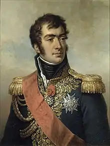 Painting of a man with dark hair, eyebrows and sideburns. He wears a dark blue military uniform with epaulettes, a high collar, many decorations and a red sash across his shoulder.