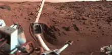 Trenches dug into the Martian surface by the Viking I Lander.  The color is fairly accurate with the pink sky.  The trenches are in the "Sandy Flats" area of the landing site at Chryse Planitia. The boom holding the meteorology sensors is at left.  Click on image to see more details.