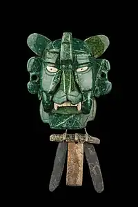 Mosaic mask that represents a Bat god, 25 pieces of jade, with yellow eyes made of shell. It was found in a tomb at Monte Albán