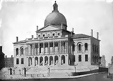 Black-and-white pencil drawing of brick building with dome