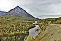 The Glenn Highway on the right side of the Matanuska River and Kings Mountain at mile 76 (km 123).