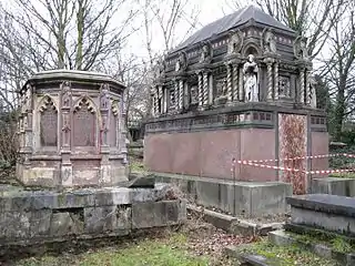 The iron monument of Grissell on left, grade II, the granite and limestone mausoleum of Alexander Berens by E.M. Barry on right, grade II*