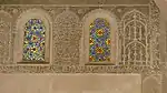 Coloured glass windows above in the prayer hall, with stucco grilles and surrounding stucco decoration