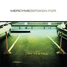 An empty parking space, fenced off with ropes and marked "reserved", is flanked by two spaces with cars in them. The top of the cover reads "MercyMe - Spoken For".