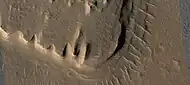 Close view of layered mesa with pyramid shapes, as seen by HiRISE under HiWish program