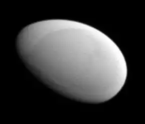 A smooth, featureless ellipsoidal object illuminated from the top right, distinctly looking like an egg.