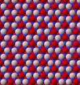 View of trioctahedral sheet structure of mica. The binding sites for apical oxygen are shown as white spheres.