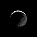 The transition from light to dark takes place on two fronts in this image of Mimas.