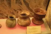 Burial pots, with the right having wave designs