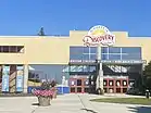 Front entrance of brick and glass building. Sign near roof top says Minnesota Discovery Center.