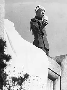 Author Yukio Mishima wearing a hachimaki moments before his death.