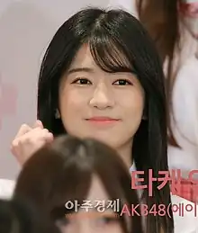 Takeuchi on Produce 48 in June 2018